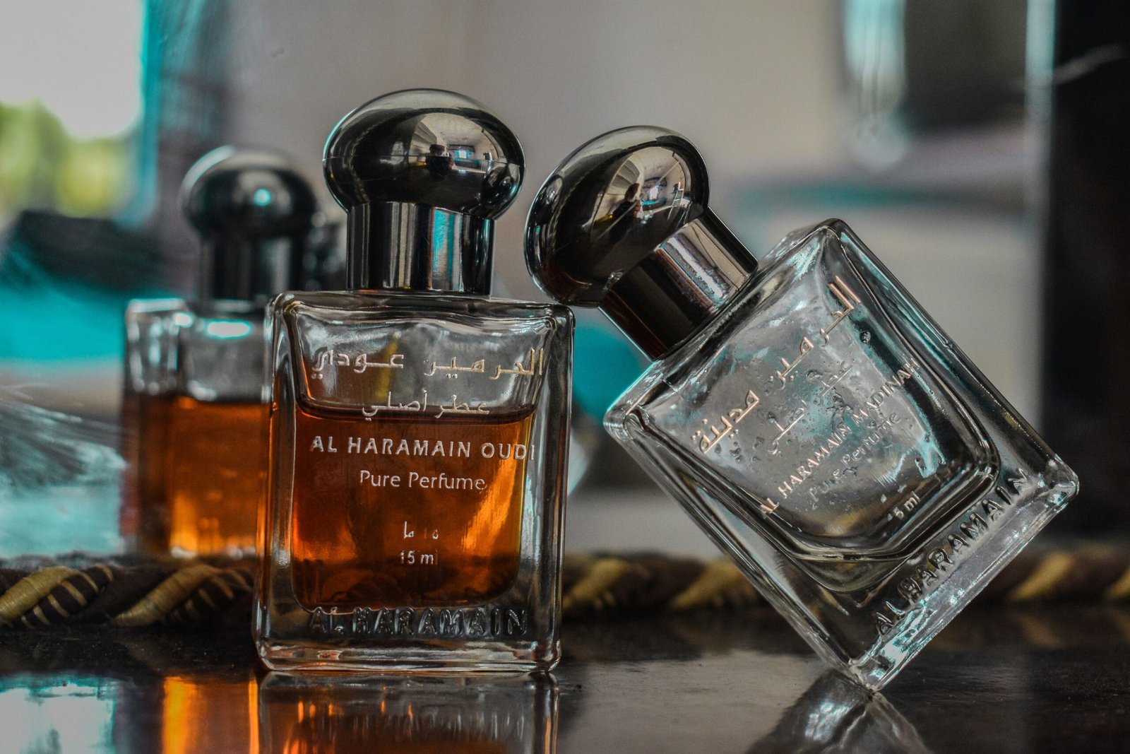 selective focus photography of clear glass perfume bottle